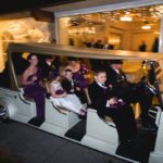 Large golf cart with wedding party