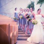 bride and bridesmaids on stairwell